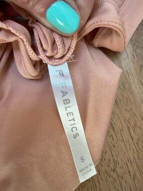Fabletics Vada Long Sleeve Zip-Pocket Hoodie in Peach Pink